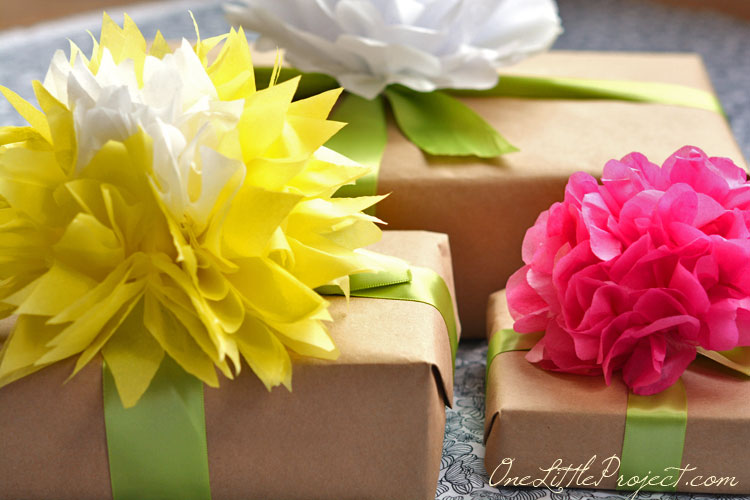 Gift wrapping with tissue paper flowers is a simple way to wrap gifts, but it looks so beautiful!  This would be perfect for Mother's Day!