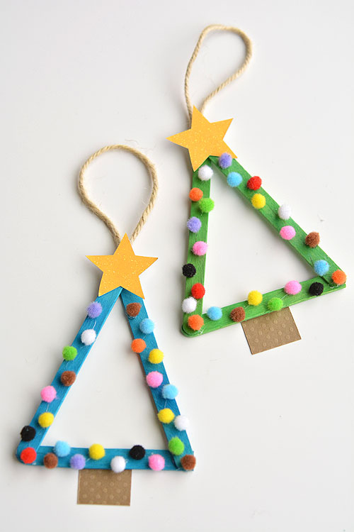 These little Christmas ornaments are not only adorable but perfect for using whatever you have at hand - buttons, gems, stickers or anything else that strikes their fancy! || Popsicle Stick Christmas Trees via One Little Project ||15 Christmas ornaments kids can make using pom poms! || Letters from Santa Holiday Blog