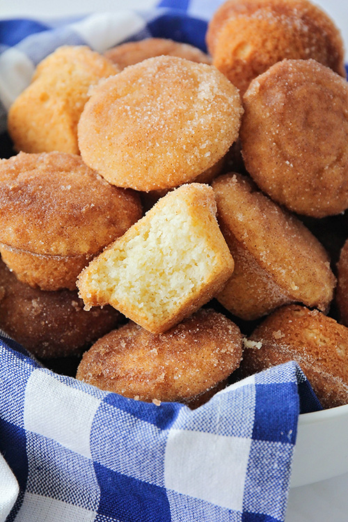 These bite-sized cinnamon sugar mini muffins are so sweet and delicious! They're so light and fluffy, and dipped in cinnamon sugar for extra flavor!