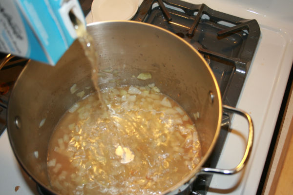 chicken broth poured over onions
