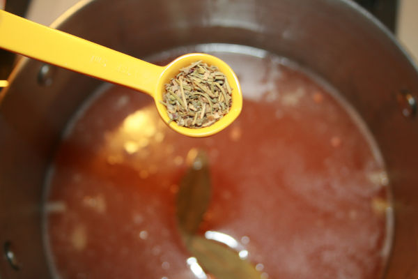 Adding the italian seasoning to the soup
