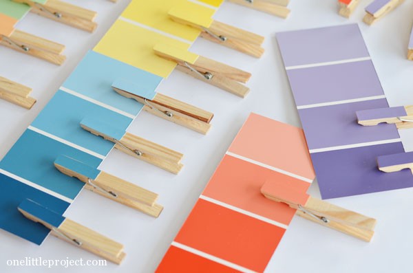 Several paint swatches with matching clothes pins