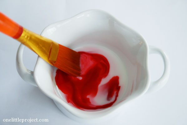 mixing milk and red food colouring