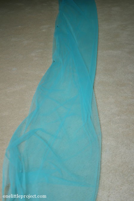 folded and safety pinned blue tulle