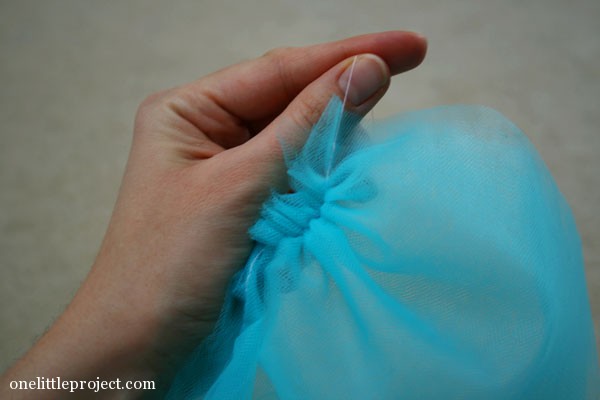 pulling thread to gather blue tulle