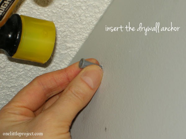 insert drywall anchors using a rubber mallet