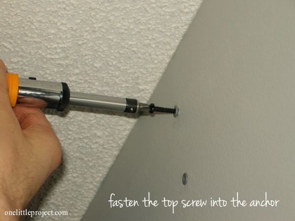 fasten screw into drywall anchor