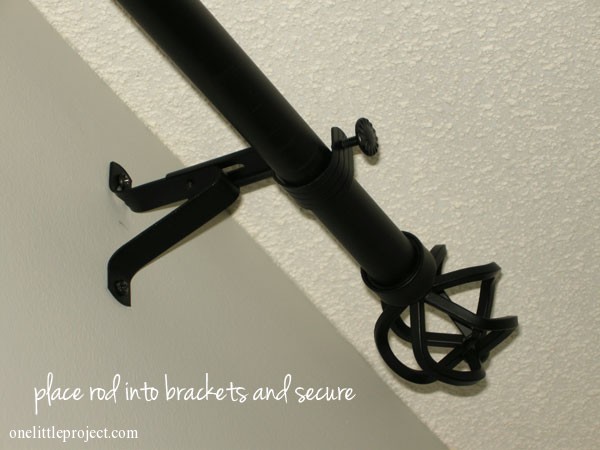 place rod into brackets and secure
