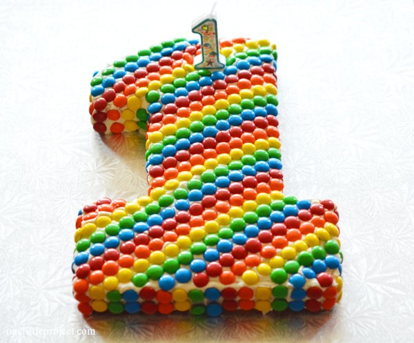 Rainbow party ideas: rainbow M&M's first birthday cake