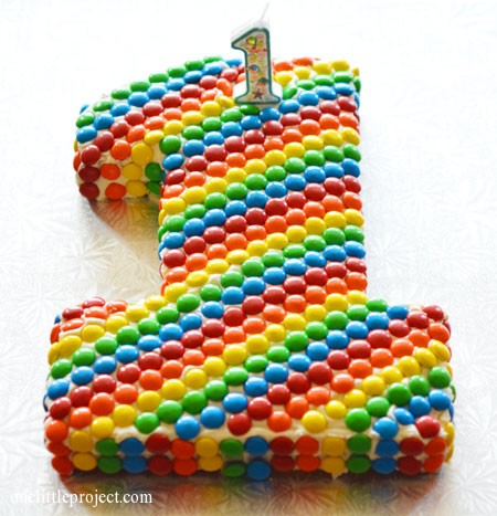 Rainbow M&M's first birthday cake