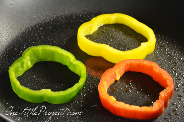 Why didn't I think of this sooner??  Cook eggs in bell pepper rings for an easy, healthy and beautiful breakfast!  Genius!