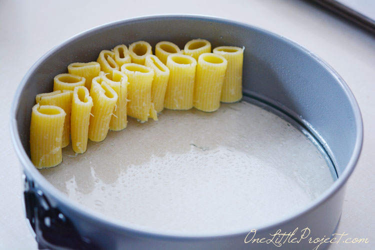 How fun is this? Stand up rigatoni noodles in a spring form pan and suddenly you have rigatoni pie, a fun and totally different way to serve pasta when you are in a slump!