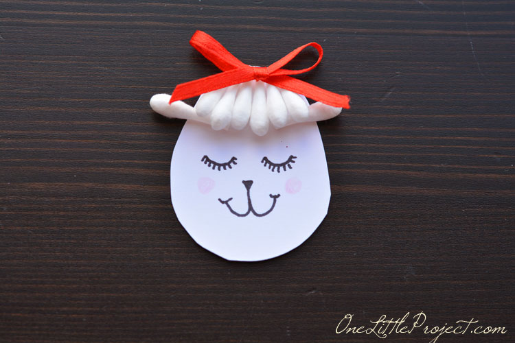 Use this adorable q-tip lamb craft as a place card holder, set up a few in a spring display on the mantle or just make it as a fun activity with your kids!