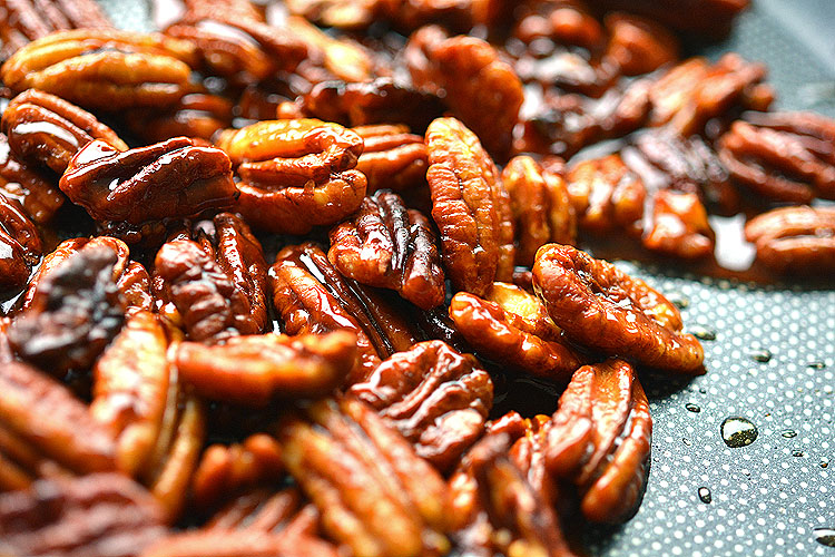 These candied pecans couldn't be any easier! Just three simple ingredients, one frying pan, and they are ready to eat in less than 10 minutes!