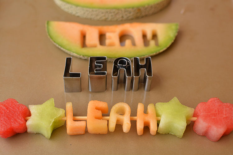 These mini alphabet melon skewers are a fun and healthy snack idea! Cut out the letters from fresh fruit and slide them onto a skewer!