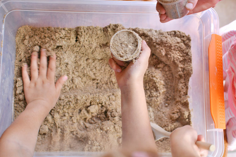 This moldable play sand recipe has just three ingredients! It has a great texture and it doesn't stick to your hands, so it's really easy to clean up!