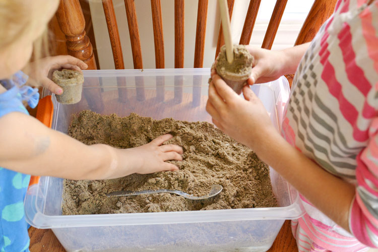 This moldable play sand recipe has just three ingredients! It has a great texture and it doesn't stick to your hands, so it's really easy to clean up!