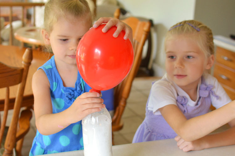 This was such a FUN science experiment! Mix together vinegar and baking soda and watch as the reaction inflates the balloon!