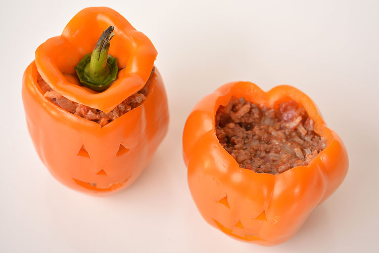 These stuffed pepper jack-o-lanterns make a fabulously healthy Halloween meal idea! They are surprisingly simple to make, and they look absolutely adorable!