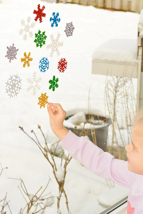 These snowflake window clings are so easy to make and they end up looking SO PRETTY! They're a great decoration that can be left up all winter!