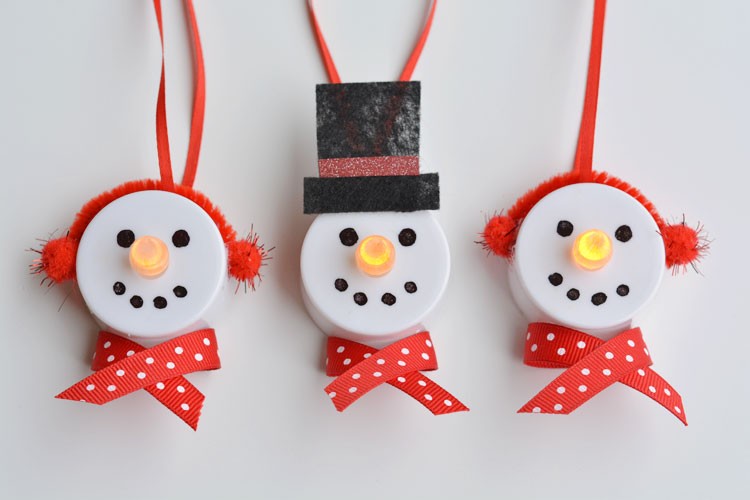 Snowman ornaments made from tealight candles