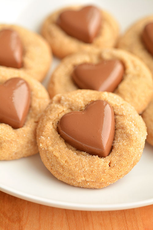 These chocolate heart peanut butter cookies are the EASIEST cookies ever! They only use 3 ingredients plus the chocolate hearts and they and taste amazing!!
