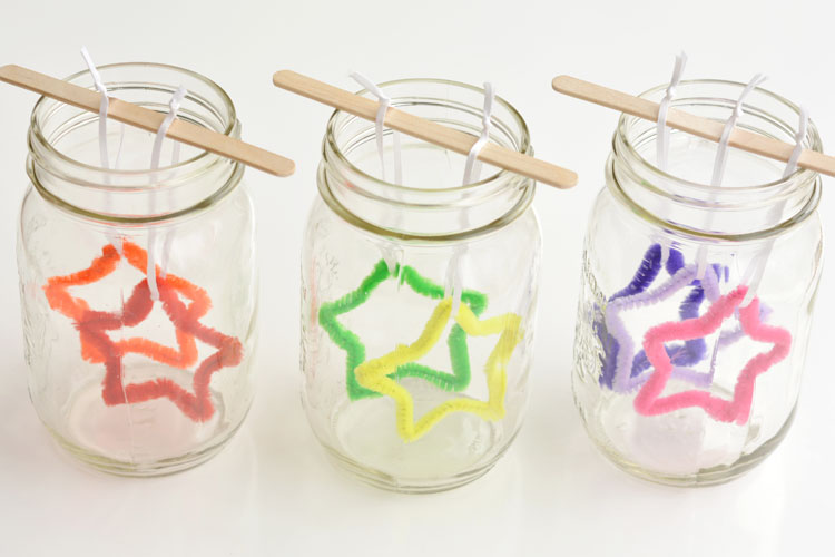 Pipe cleaner stars hanging in mason jars