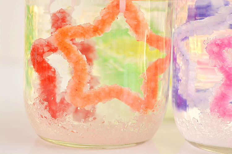 Borax crystals on pipe cleaner stars in jar