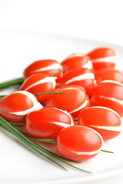 These cherry tomato tulips are SO PRETTY and they taste amazing! They'd be a great appetizer for a party or even Mother's Day! And the whipped feta filling is soooo good!