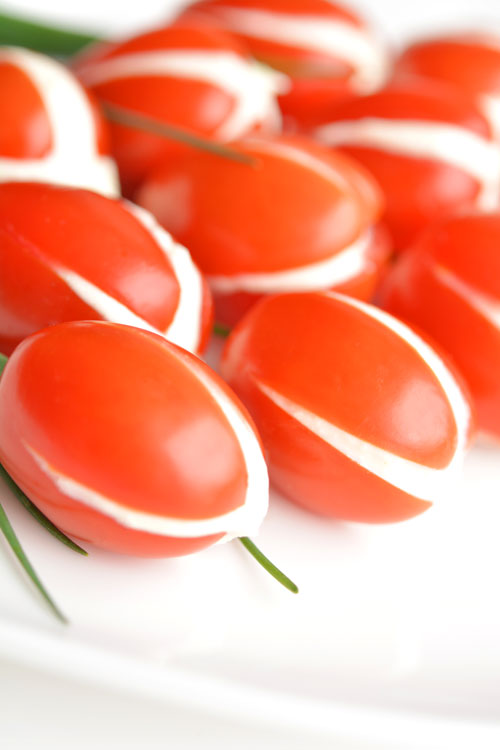 These cherry tomato tulips are SO PRETTY and they taste amazing! They'd be a great appetizer for a party or even Mother's Day! And the whipped feta filling is soooo good!
