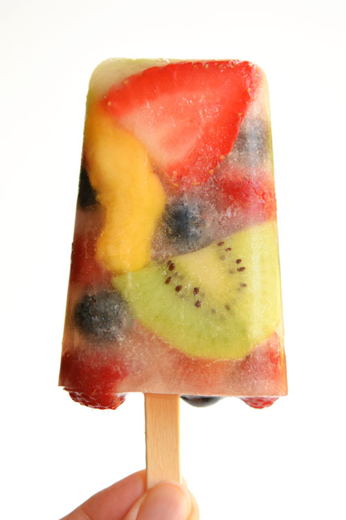 Close up of fruit popsicle in hand
