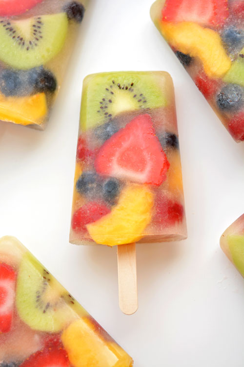 Close up of real fruit popsicle on white background