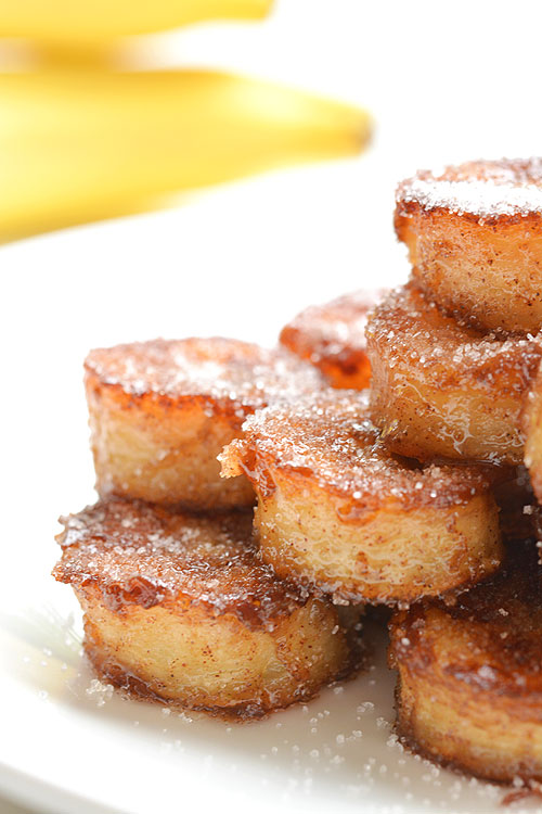 These pan fried cinnamon bananas are so easy to make and taste SO GOOD! They're amazing (seriously AMAZING) on ice cream or pancakes, or just as a snack. Soft and sweet on the inside and caramelized on the outside. Mmmm...