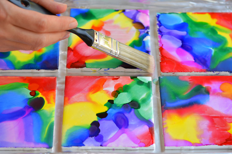 These Sharpie dyed tile coasters are SO BEAUTIFUL and they're really easy! Wouldn't they make a thoughtful homemade gift idea? No one would ever guess how simple they are to make!