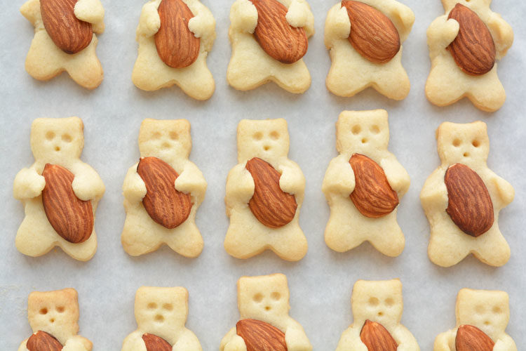 Teddy bear sugar cookies hugging an almond