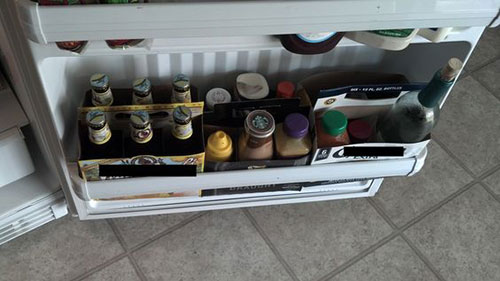 25 Hacks to Organize your Fridge - Keep those cardboard six pack containers and use them to keep the fridge door organized