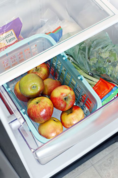 25 Hacks to Organize your Fridge - Make it easy to access your fruit by placing a basket in the crisper drawer