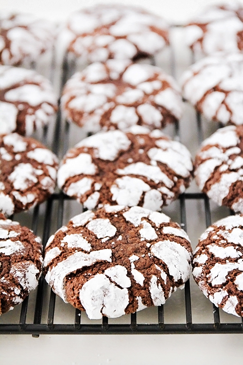 These chocolate crinkle cookies are DELICIOUS, so flavorful, and super easy to make! They're soft and rich almost like a cross between a brownie and a cookie. The perfect treat for any chocolate lover!
