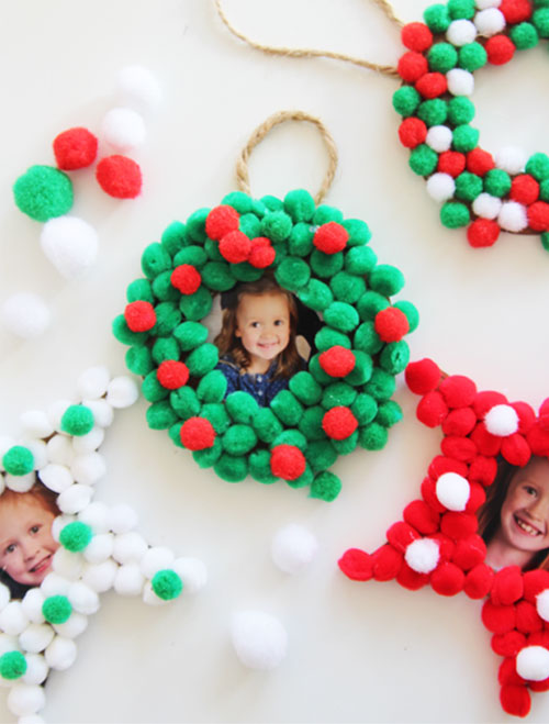 These pom pom Christmas photo ornaments are SO EASY for kids to make and would make the perfect addition to any tree this holiday!