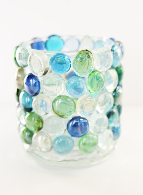 These glass bead candle holders are SO EASY to make and they look so pretty! Such a simple and beautiful dollar store craft project! Look at the beautiful shadows it makes!