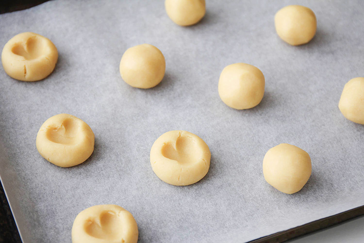 These rich and buttery gummy bear heart cookies have a sweet and chewy candy center and a simple shortbread base. They're so delicious and adorable too!