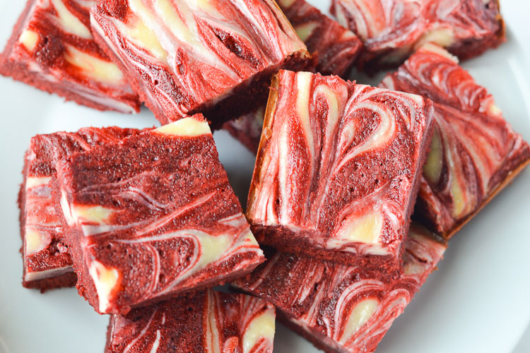 These red velvet cheesecake brownies are AMAZING! Perfectly marbled with creamy cheesecake filling, these make a simple and delicious Valentine's Day dessert!
