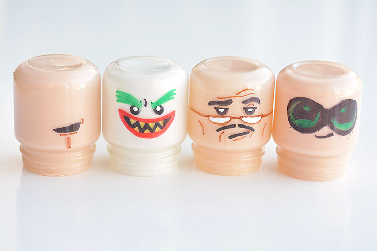 Baby food jars are the exact same shape as LEGO heads!!! Just draw on the faces and paint the jars! These Lego Batman night lights are SO CUTE! What a fun little project!