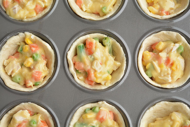 These mini chicken pot pies are SO EASY with only 4 ingredients! Such a fun and delicious 30 minute meal idea when you have a craving for comfort food!