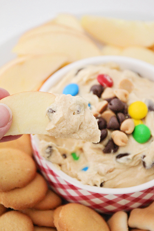 This sweet and delicious peanut butter cookie dough dip is so addicting! It's perfect with fresh apple slices, animal crackers, or pretzels!