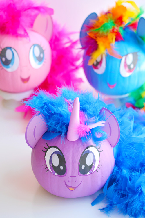 These no-carve My Little Pony pumpkins are SO EASY! Seriously, you paint the pumpkin, peel off the cute little printable faces and add a dollar store feather boa as the hair. So simple! (And best use of a feather boa, ever!) 