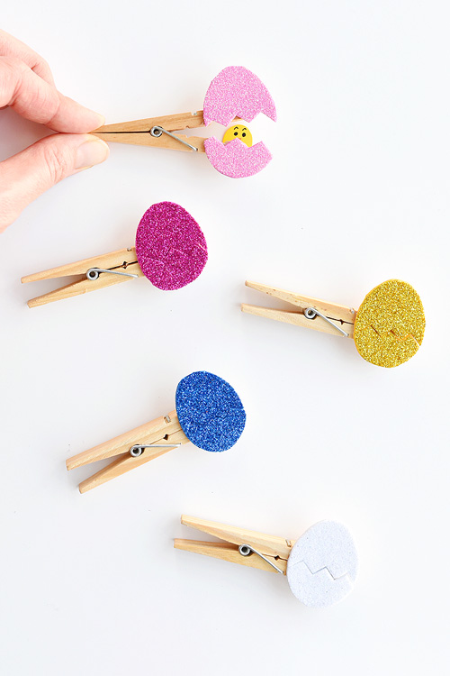 These peekaboo clothespin eggs are so easy to make and they look SO CUTE! Each one takes less than 5 minutes to make and they look adorable! They're an awesome low mess craft idea and are such an adorable Easter craft idea!! My kids loved seeing the surprise chick inside the egg!