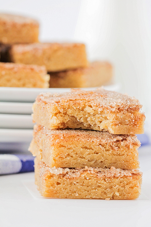 These sweet and cinnamony snickerdoodle cookie bars are so easy to make and addictingly delicious! They're soft and chewy, and topped with a to-die-for cinnamon sugar crust! 