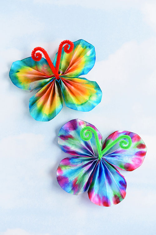 These classic coffee filter butterflies are SO EASY and so beautiful! This is such a great summer craft idea for kids and a fun low mess activity! It's easy. It's relatively low mess. It's even a bit of a science experiment when you wet the coffee filter and watch the colours blend!