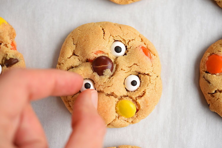 These Reese's Pieces peanut butter eyeball cookies are so much fun! And they taste SO GOOD! The cookies are soft, chewy and delicious! These little monster cookies are such a fun treat to bake for Halloween!